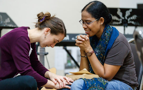 girl in church praying